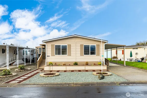 a backyard of a house with wooden fence