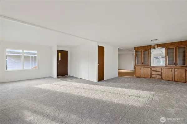 a view of a livingroom with a kitchen
