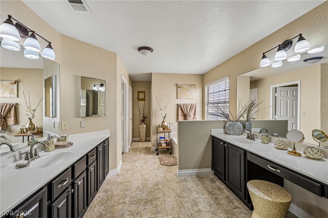 5236 Saranac Road Las Vegas, NV 89130 - Photo 30 of 52 Double Vanities with ample counter space and cabinets