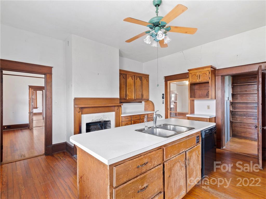 5593 Old Clyde Road Clyde, NC 28721 - Photo 14 of 35 a kitchen that has a table and chairs in it