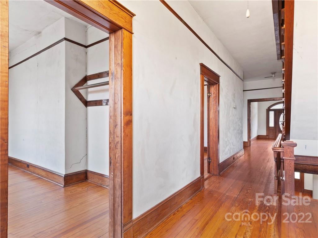 5593 Old Clyde Road Clyde, NC 28721 - Photo 20 of 35 a view of hallway with livingroom and wooden floor