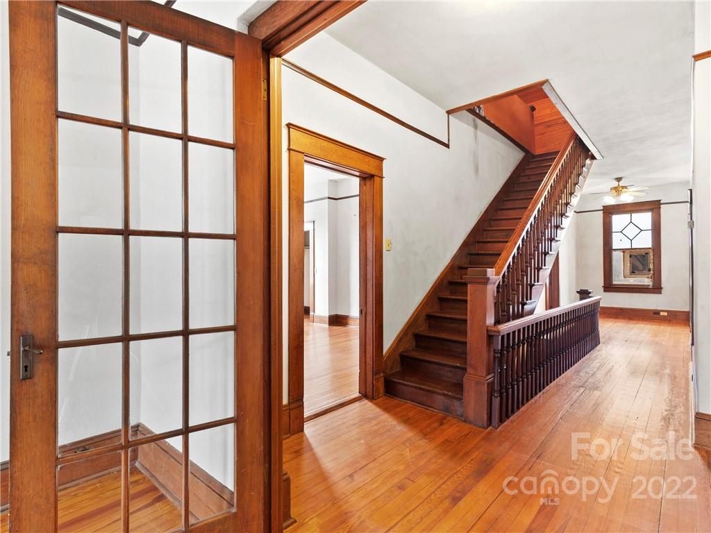 5593 Old Clyde Road Clyde, NC 28721 - Photo 32 of 35 workspace with wooden floor and stairs
