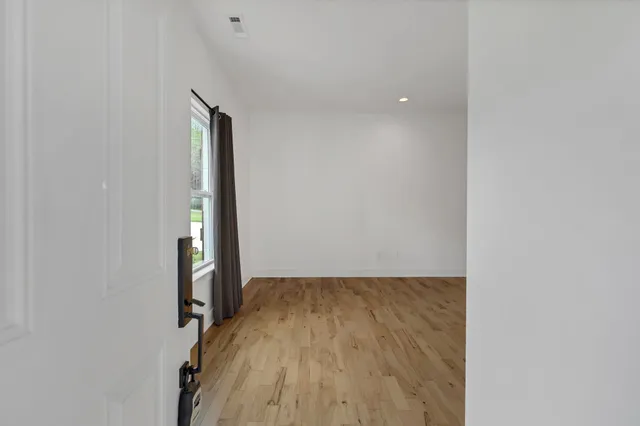 a view of small space with wooden floor