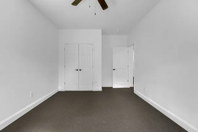 a bathroom with a shower and a toilet