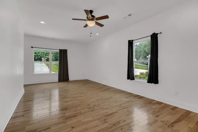 a view of an empty room with a window