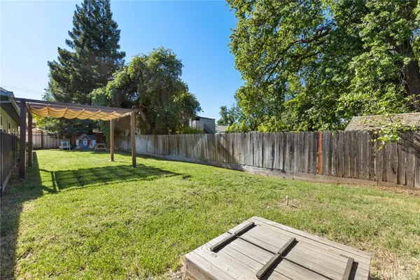 a backyard with a garden and entertaining space
