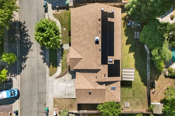 an aerial view of a house with yard and outdoor seating