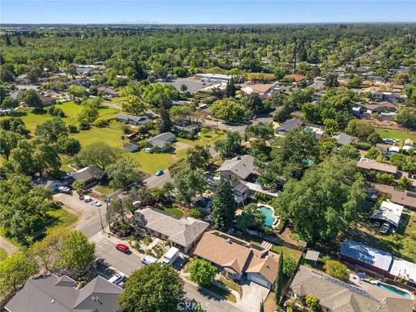 an aerial view of residential houses with outdoor space