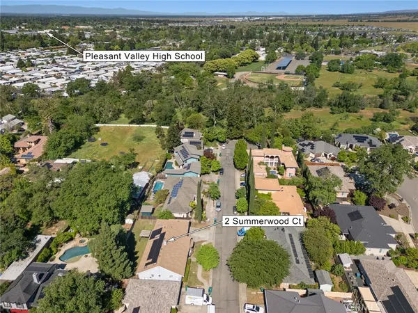 an aerial view of residential houses with outdoor space