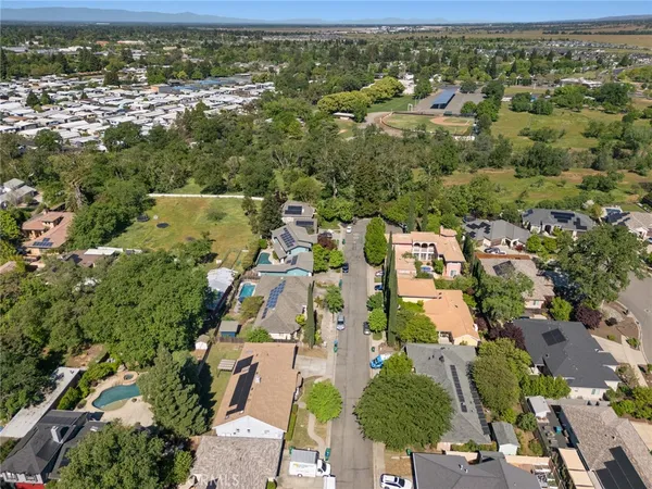 an aerial view of residential houses with outdoor space