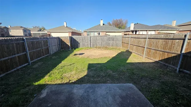 a view of a backyard with a tub