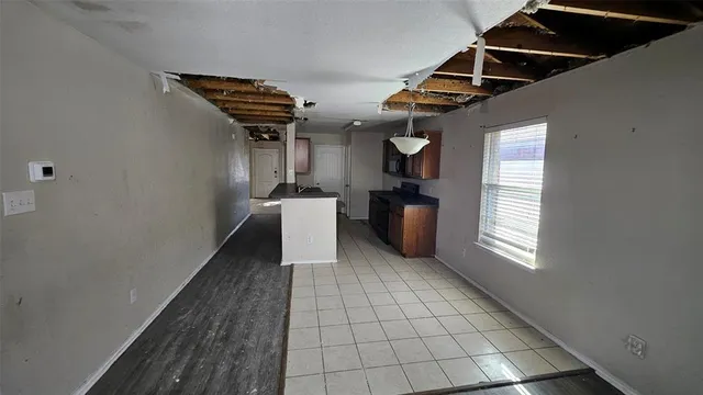 a view of an empty room with windows