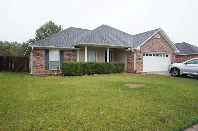 a view of a house with a garden