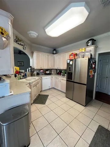 a kitchen with stainless steel appliances granite countertop a refrigerator sink and microwave