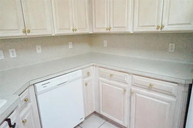 a view of cabinets and window