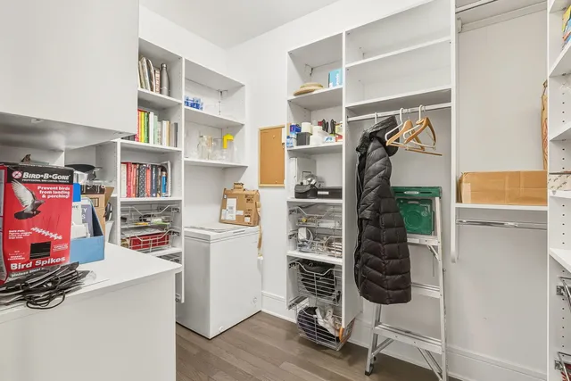 a view of a hallway with chandelier