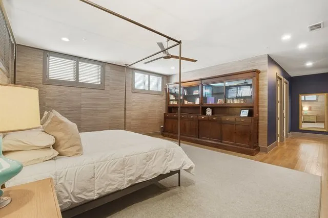 a bedroom with a bed and a walk in closet
