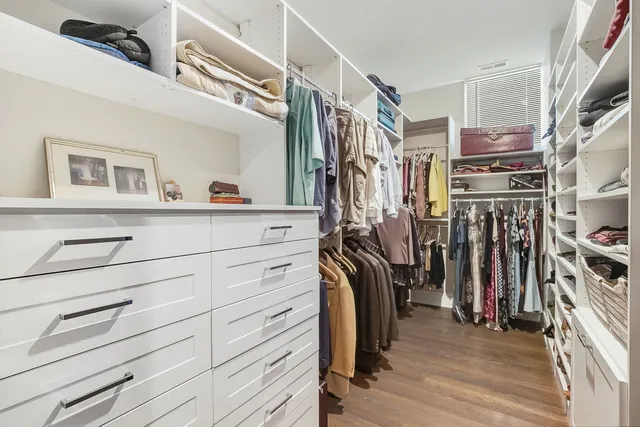 a view of a room with a table and chairs