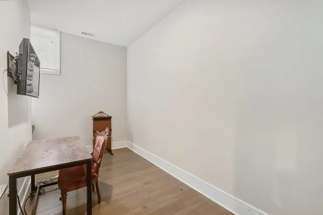 a bedroom with a bed and a bookshelf