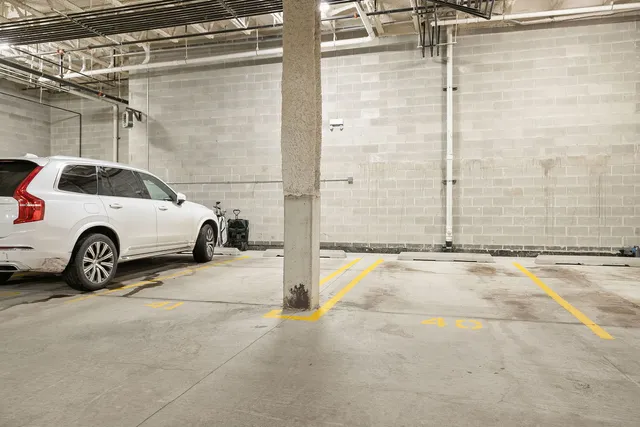 a bathroom with a green shower and a yard