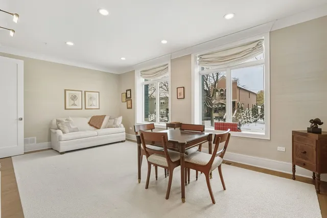 a dining room with a bookshelf and a book shelf