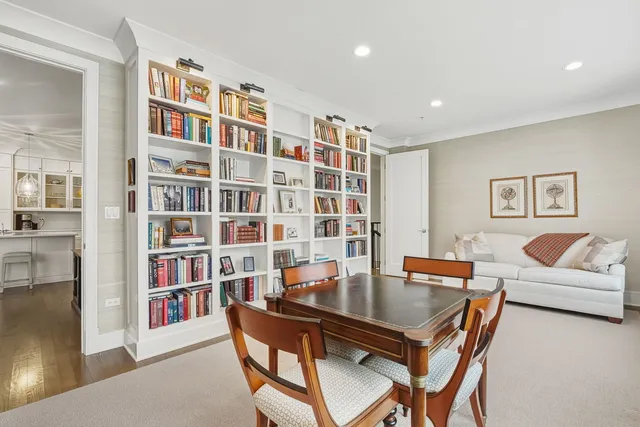 a bathroom with a toilet a sink a mirror and vanity