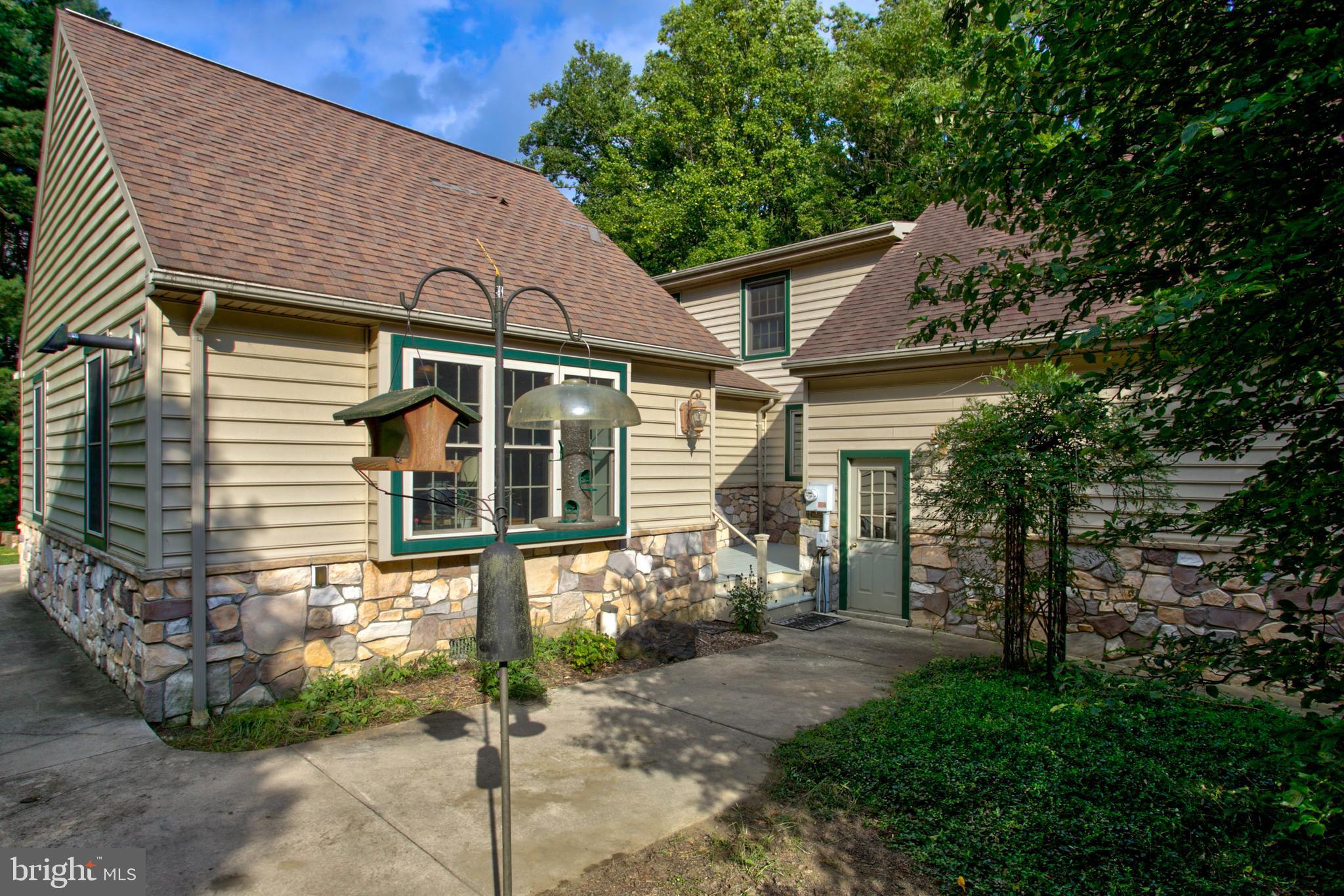 246 Marticville Road Conestoga, PA 17516 - Photo 41 of 59 Side Patio with French Doors into Family Room