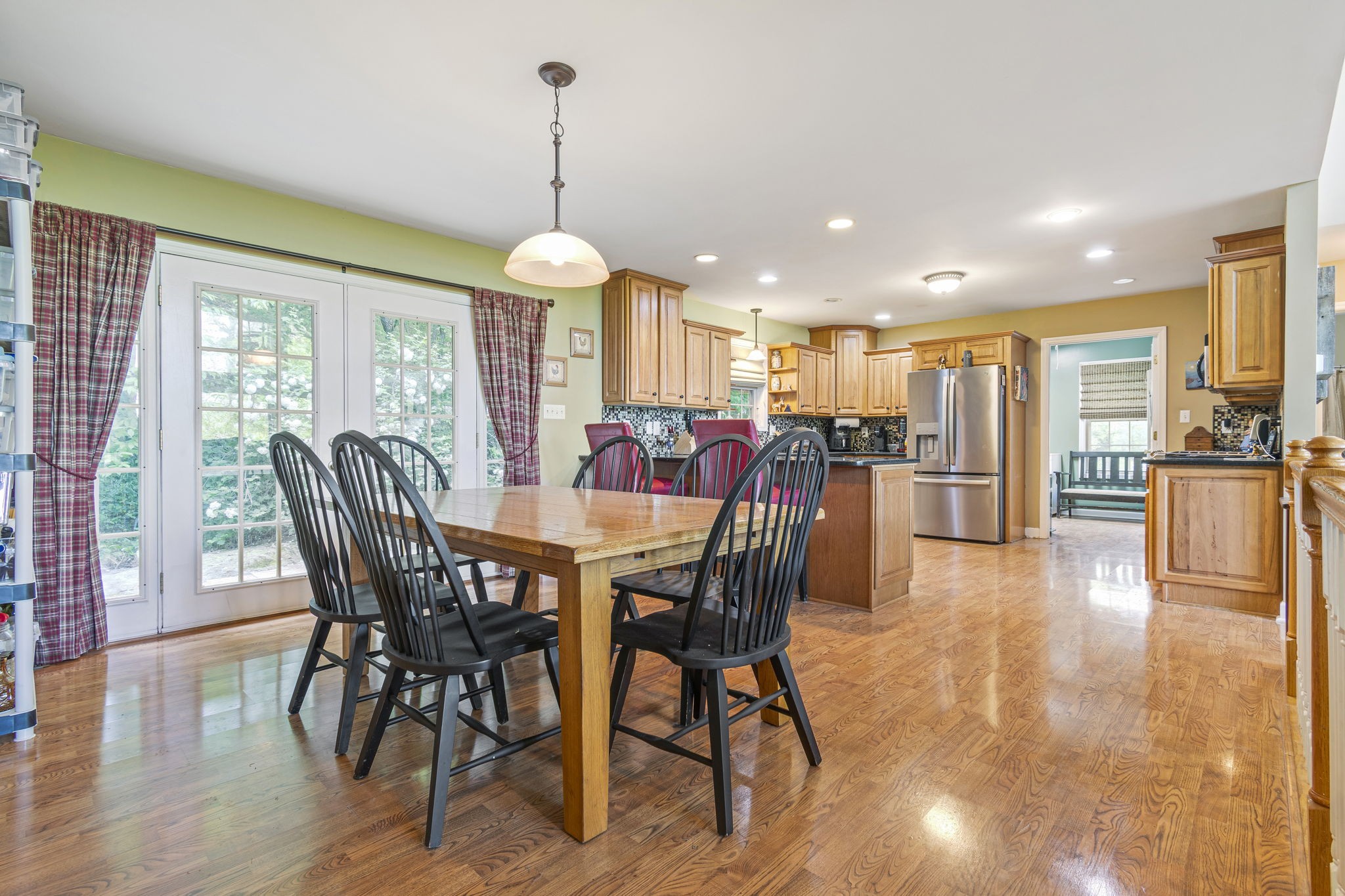 300 Gunter Smith Road Pulaski, TN 38478 - Photo 7 of 66 a view of a dining room and livingroom with furniture wooden floor a chandelier