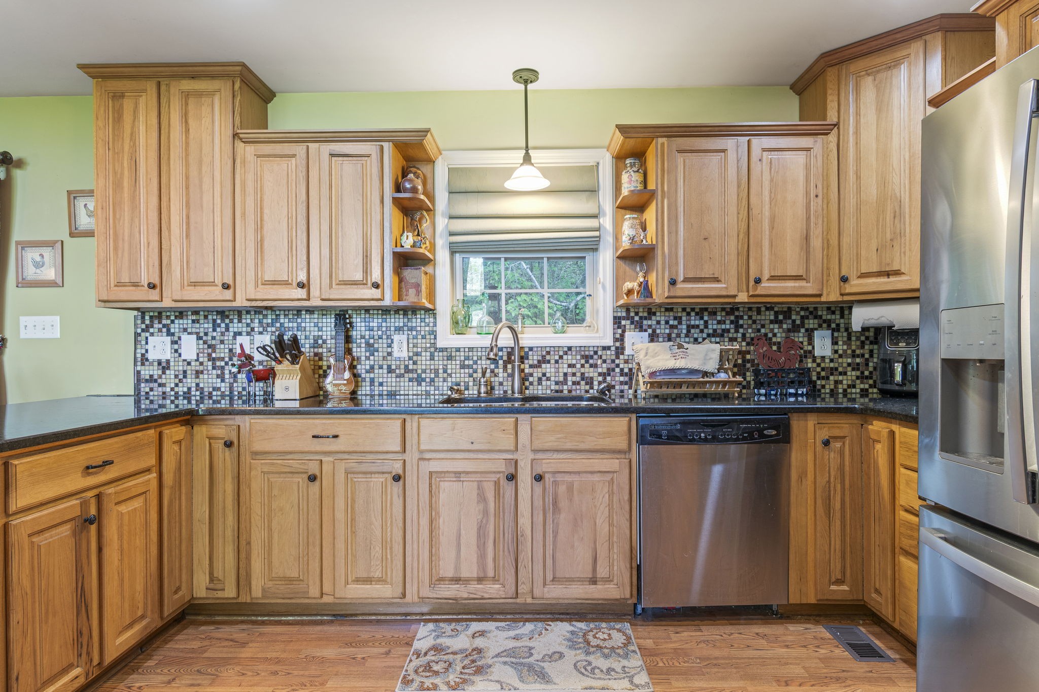 300 Gunter Smith Road Pulaski, TN 38478 - Photo 9 of 66 a kitchen with stainless steel appliances granite countertop a stove a sink and a microwave