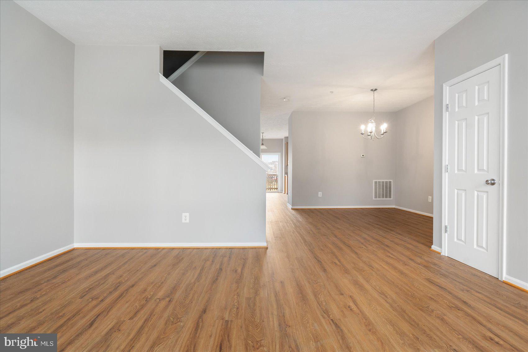 615 Tinker Road Middle River, MD 21220 - Photo 4 of 50 wooden floor in an empty room with a window