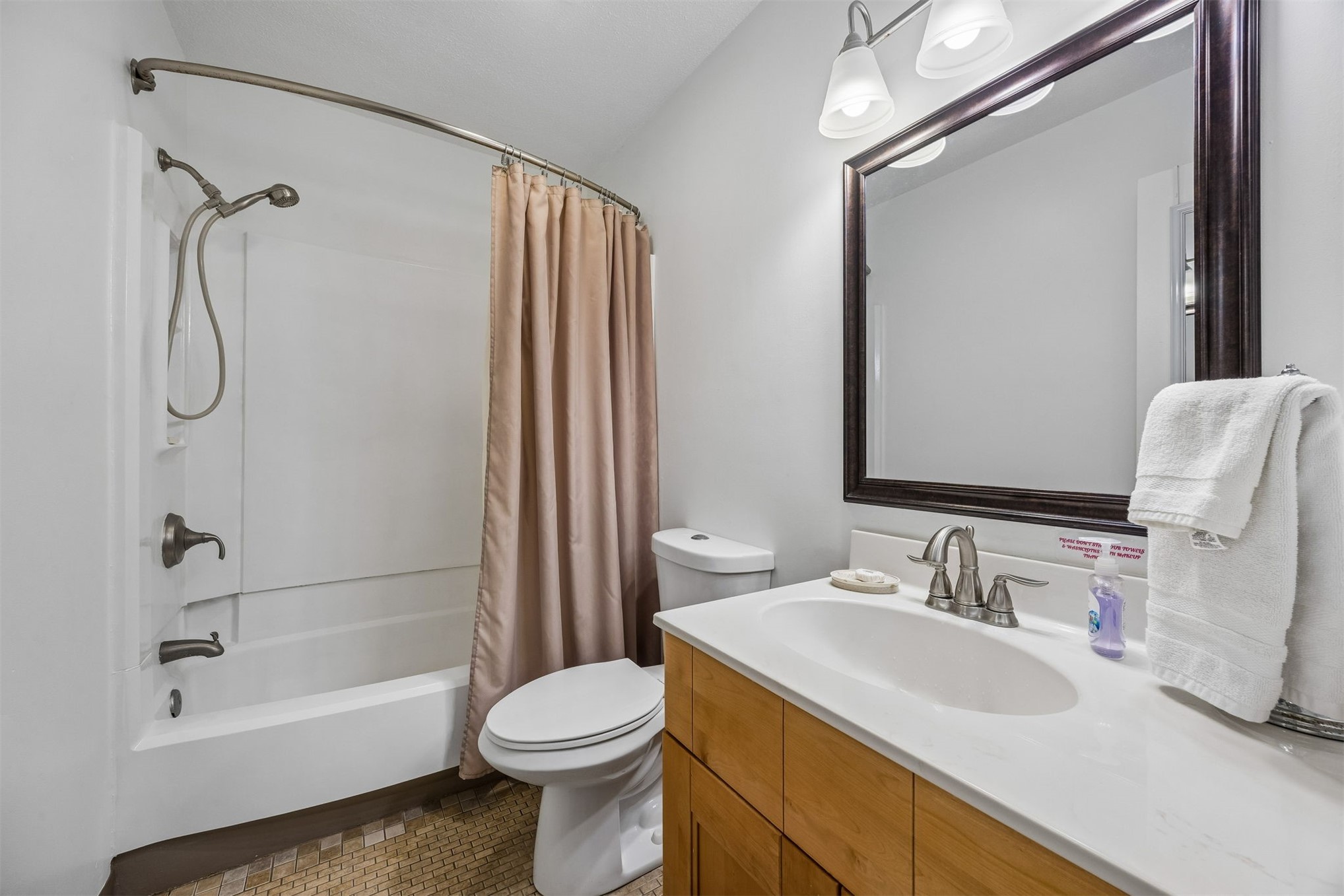2328 Sadler Road, Unit 1C Fernandina Beach, FL 32034 - Photo 26 of 49 a bathroom with a sink toilet and shower