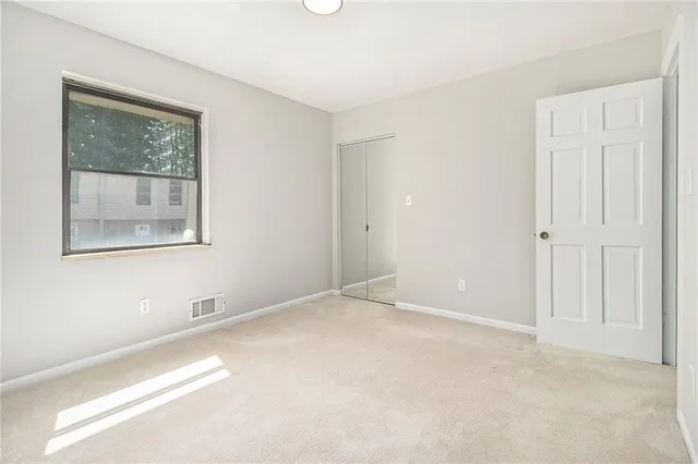 a view of a bathroom with a white door