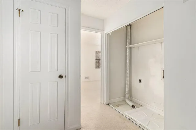 a view of a bathroom with a shower and a sink