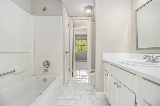 an empty room with closet area