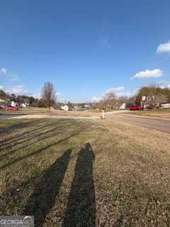 a view of a large house with a yard