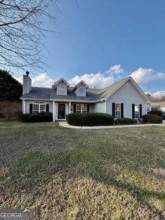 a view of house with a garden