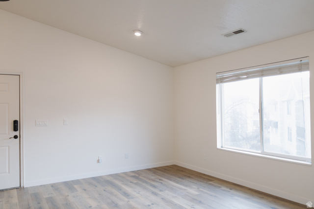 215 South 1050th West, Unit 10 Provo, UT 84601 - Photo 7 of 38 Spare room with light wood finished floors and baseboards
