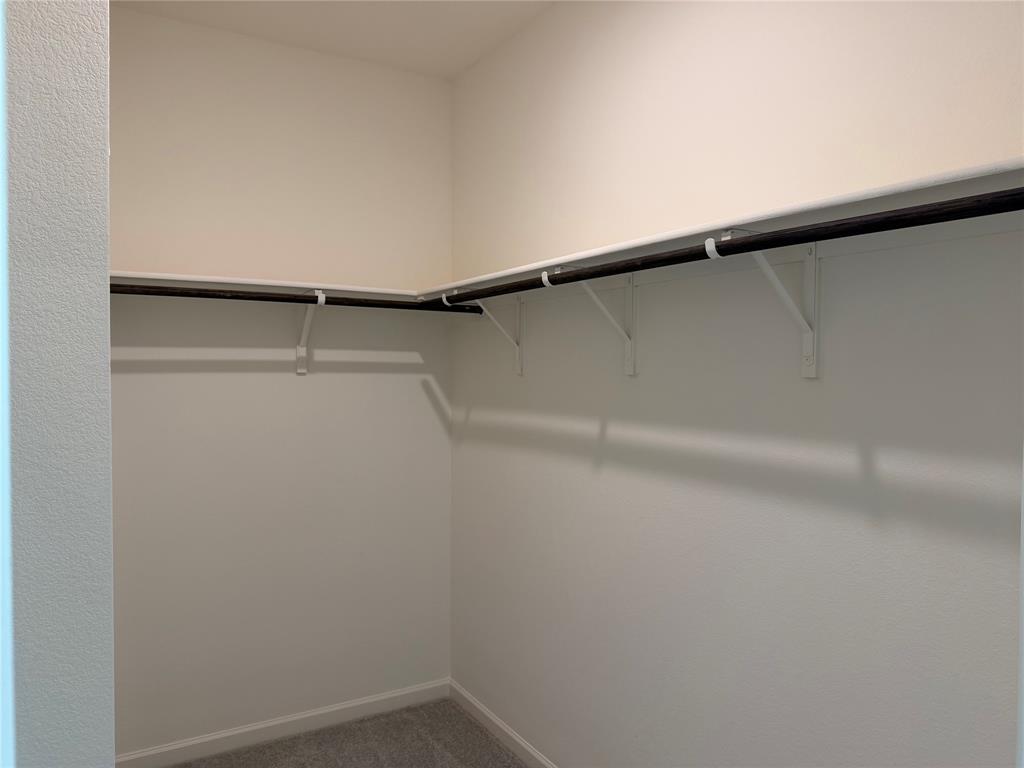 609 Merced River Lane Anna, TX 75409 - Photo 11 of 27 a view of small space with racks on the wall