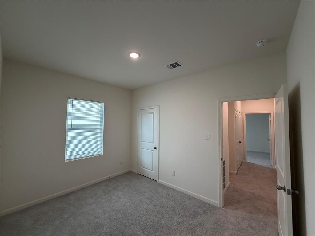 609 Merced River Lane Anna, TX 75409 - Photo 14 of 27 an empty room with windows and closet