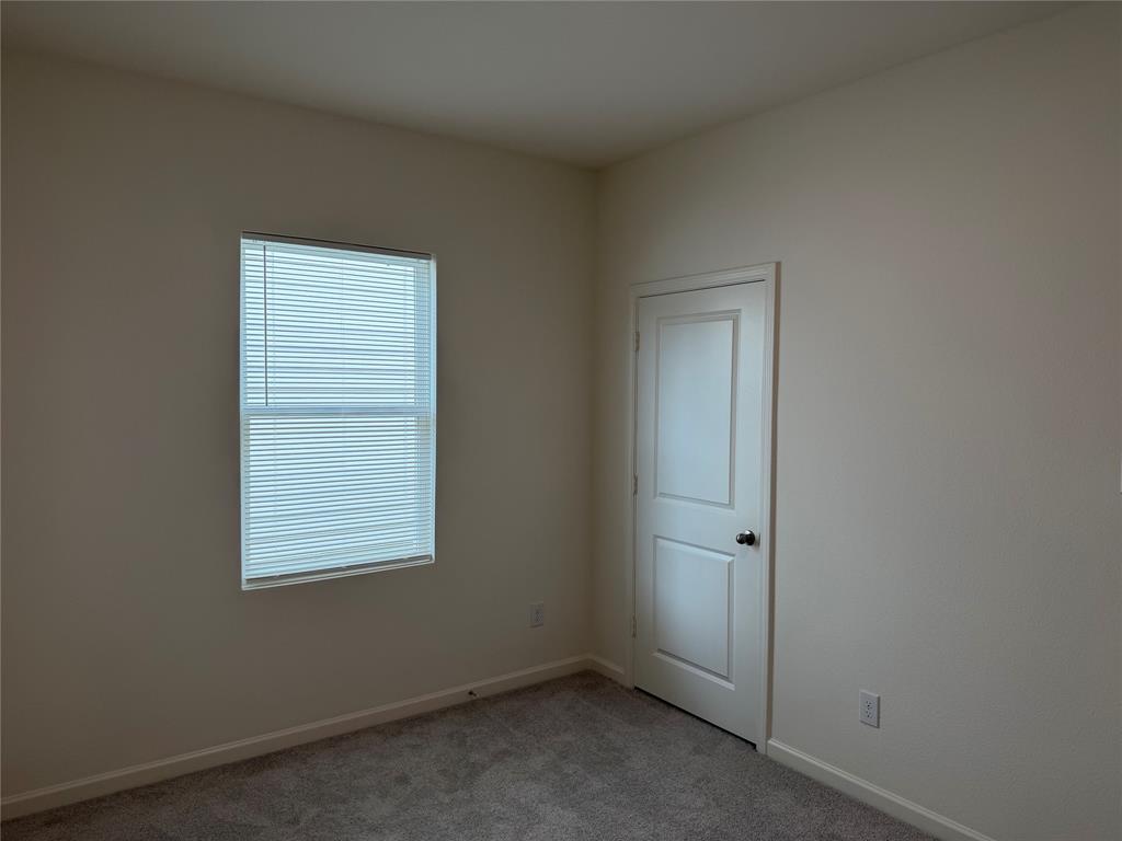 609 Merced River Lane Anna, TX 75409 - Photo 15 of 27 an empty room with a window