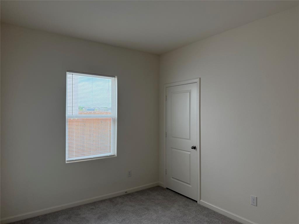 609 Merced River Lane Anna, TX 75409 - Photo 17 of 27 an empty room with a window