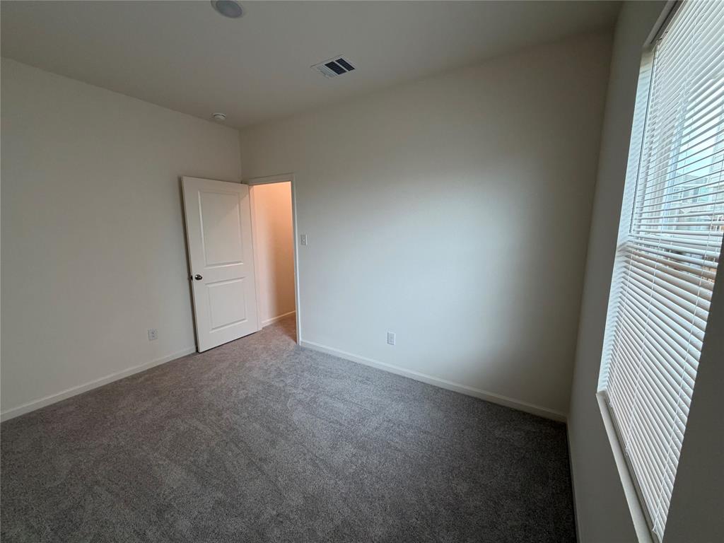 609 Merced River Lane Anna, TX 75409 - Photo 18 of 27 an empty room with windows