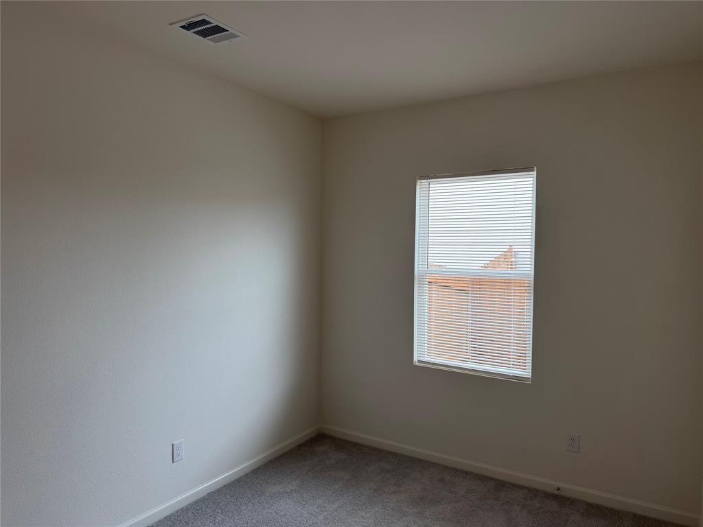 609 Merced River Lane Anna, TX 75409 - Photo 19 of 27 an empty room with a window