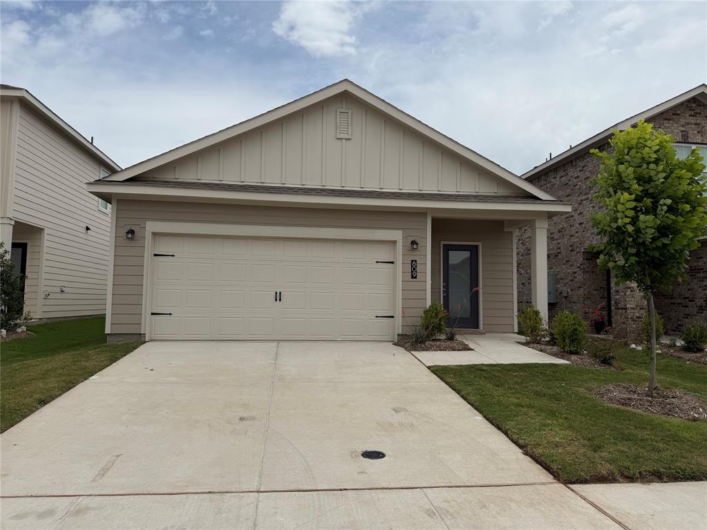 609 Merced River Lane Anna, TX 75409 - Photo 2 of 27 a front view of a house with a yard and garage