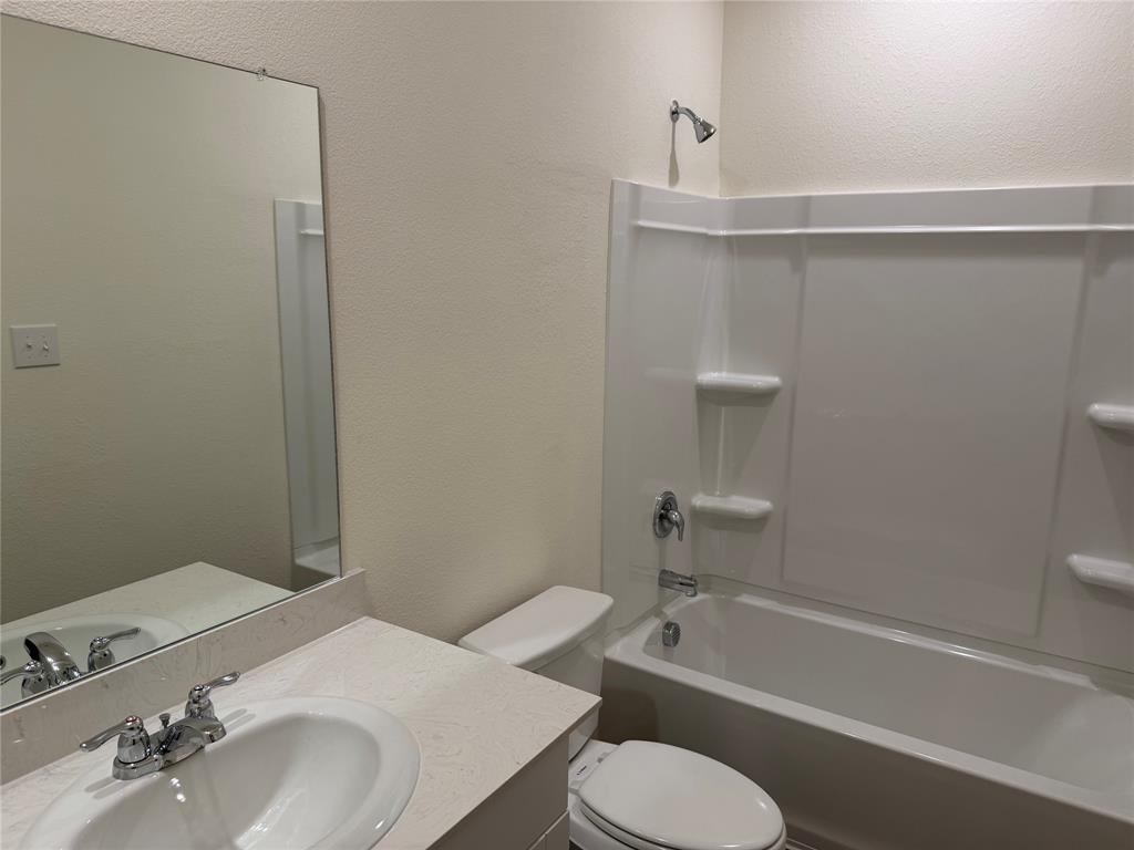 609 Merced River Lane Anna, TX 75409 - Photo 23 of 27 a bathroom with a sink toilet and bathtub