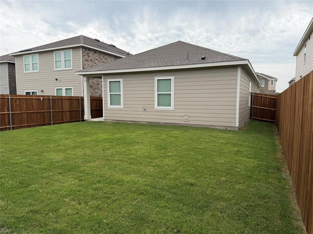 609 Merced River Lane Anna, TX 75409 - Photo 26 of 27 a front view of house with yard and trees all around