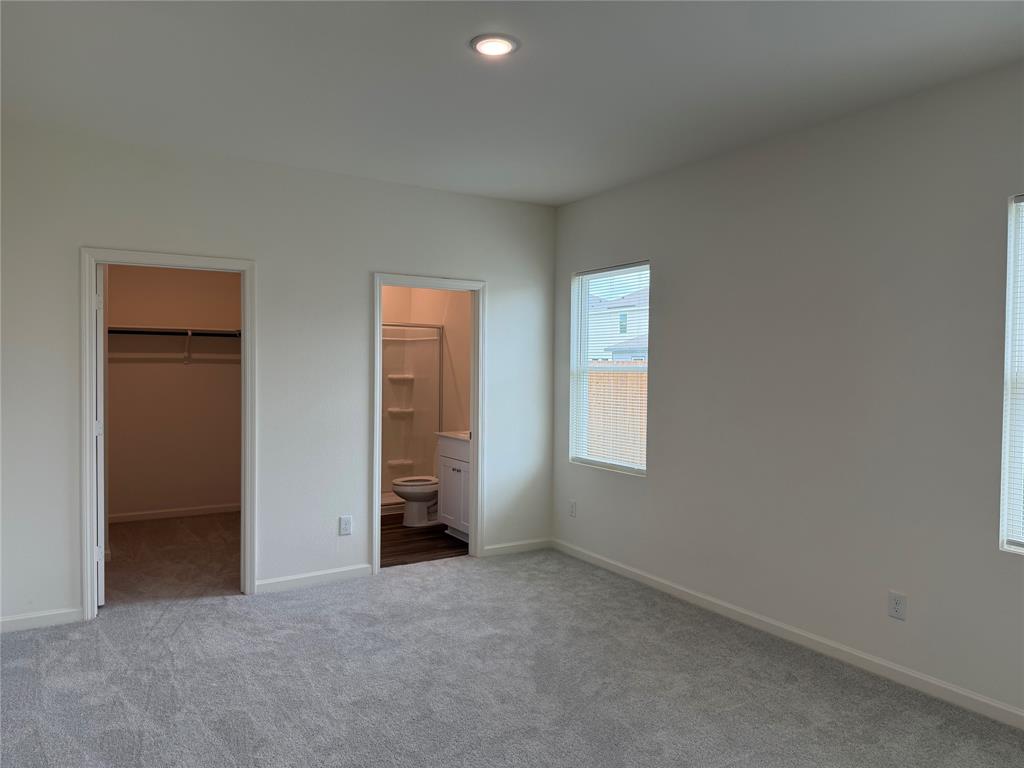 609 Merced River Lane Anna, TX 75409 - Photo 9 of 27 an empty room with windows and closet