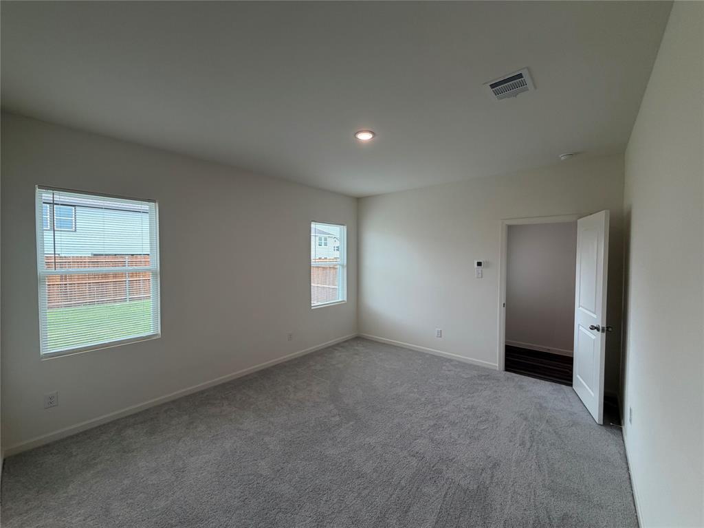 609 Merced River Lane Anna, TX 75409 - Photo 10 of 27 a view of an empty room with a window