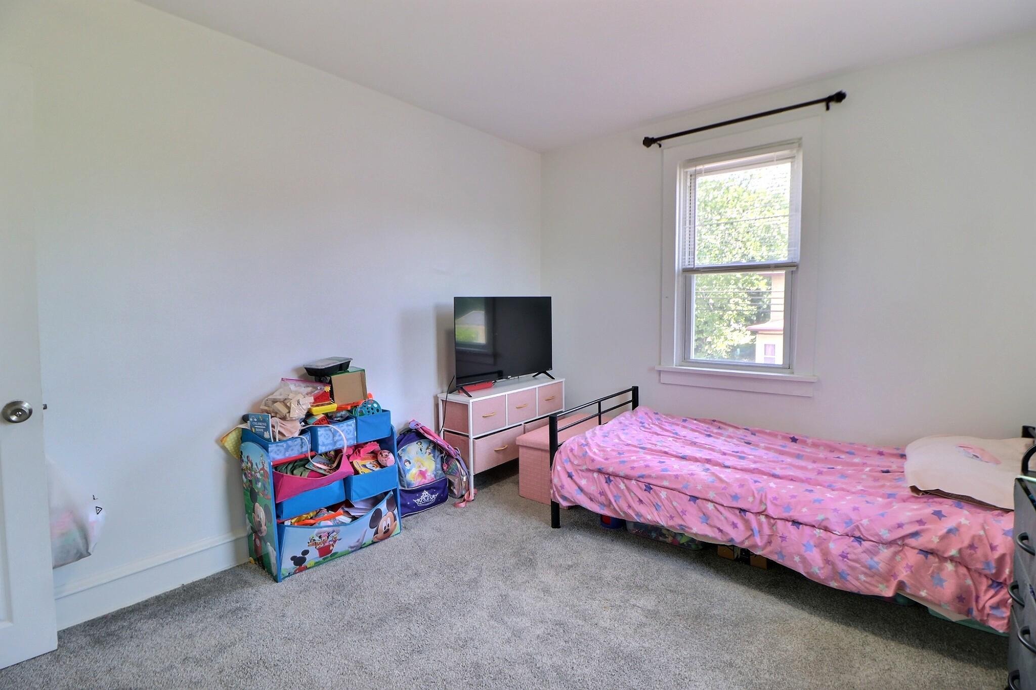 1022 Penn Line Road Paulsboro, NJ 08066 - Photo 18 of 19 a bedroom with two beds and a window