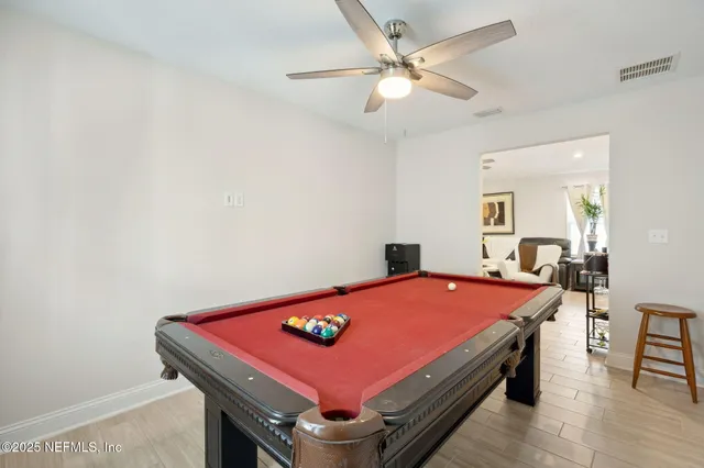 a bed room with a bed and a chandelier